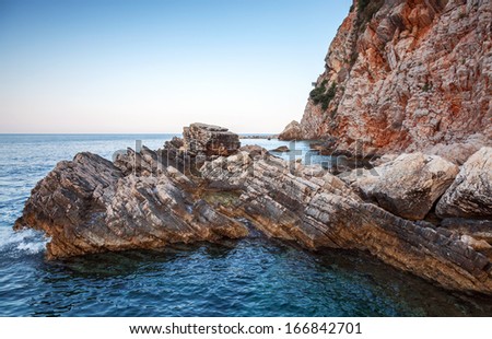 Red coastal rocks in Adriatic Sea, Montenegro