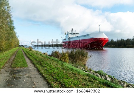 Nord-Ostsee-Kanal with cargo ship near Rendsburg, Germany