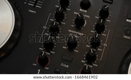 Close up of an equalizer on a DJ controller.