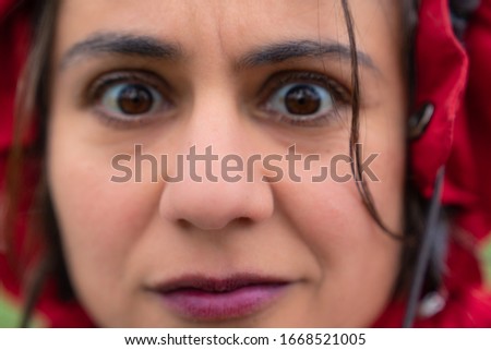 woman frightened eyes out of focus in foreground