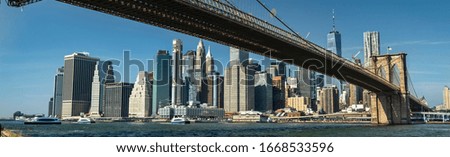 East River shoreline panorama under the Brooklyn Bridge as seen from area in New York USA