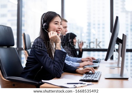 The Asian women call center is working in front of the computer with smiling face. Hot line operator support, customer relationship, service mind, 24 hours service, concept.
 Royalty-Free Stock Photo #1668535492