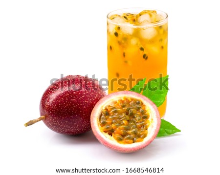Closeup glass of passionfruit (maracuya) juice with passion fruit half slice and green leaf isolated on white background. Healthy drinks concept. Royalty-Free Stock Photo #1668546814