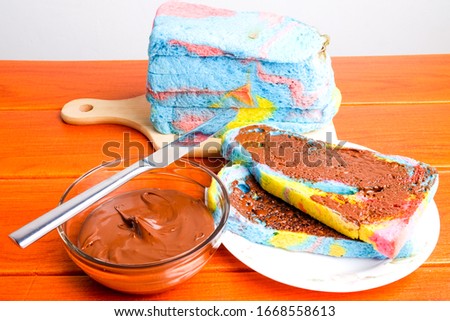 A picture of colourful bengali sliced bread with homemade chocolate spread.
