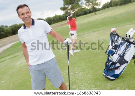 portrait of a male golfer posing