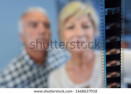 Elderly couple looking at filmstrip