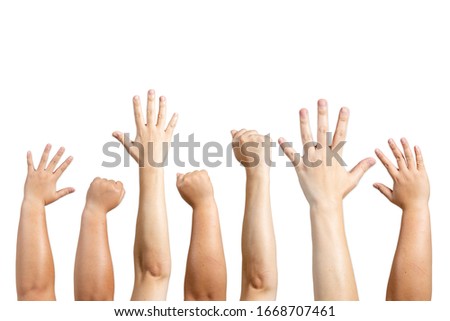 The arms of the fist and the hand of the hand and the color of the skin are different as a symbol of teamwork. Royalty-Free Stock Photo #1668707461