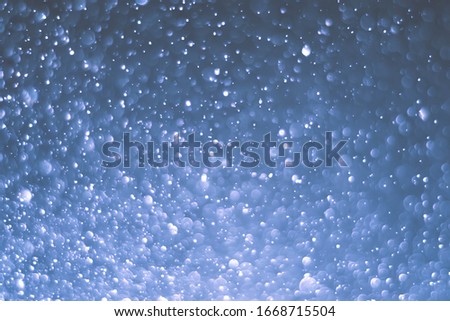 Abstract bokeh lights with light Blue background

