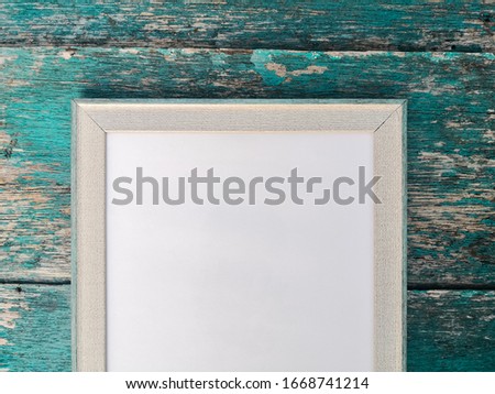 Empty blank frame over wooden for mockup