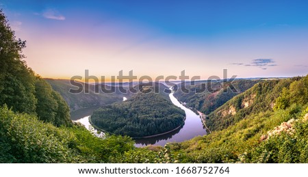 Sunset view of Saar river valley near Mettlach. South. Germany  Royalty-Free Stock Photo #1668752764