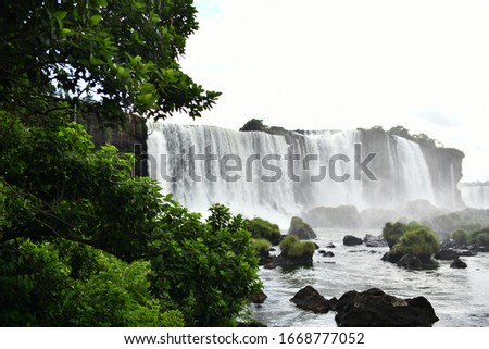 Landscape views of Iguazu Falls in Brazil in rainy weather.