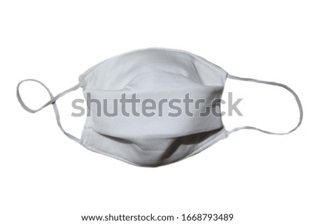 White thick cotton cloth mask on a white background