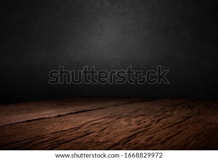 Wooden dark desk studio free space for your decoration product.Black background with space for your text. 