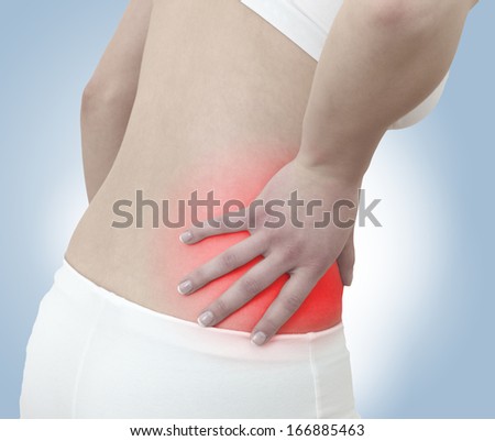 Acute pain in a woman abdomen. Female holding hand to spot of Abdomen-ache. Concept photo with Color Enhanced blue skin with read spot indicating location of the pain. Isolation on a white background.