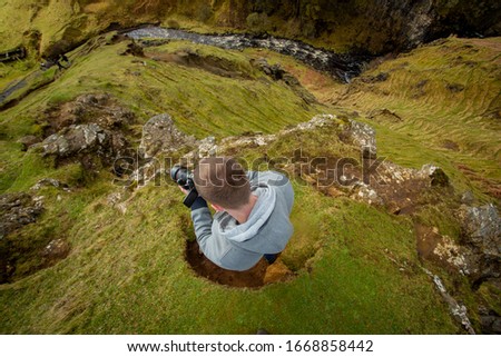 photographer shoots Scottish landscape on a mountain
