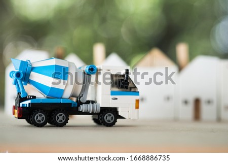 Blue cement mixer truck toy. Building and construction industry industrial business commercial concept.