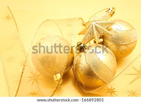 golden Christmas ball on golden background 