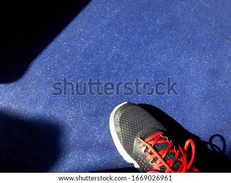 The blue background and the light from the sun make the sneakers look especially clean
