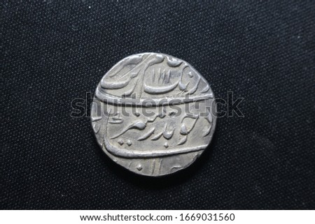  Ancient Indian coin of Mughal dynasty,   emperor Aurangzeb Alamgir dated  1699ad  or 1111hijri calendar. one of the  great king of Indian Mughal dynasty.
silver coin  side 1 and 2 Royalty-Free Stock Photo #1669031560