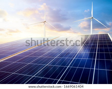 solar panels and wind generators under blue sky on sunset Royalty-Free Stock Photo #1669061404