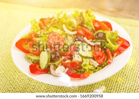 Fresh vegetable salad in plate on the desk