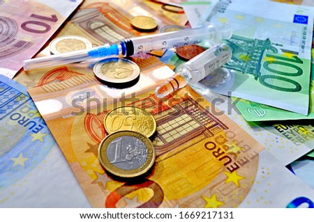 
Composition of banknotes, euro, syringe and medicine, ampoules