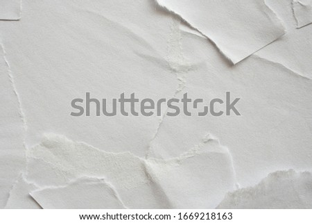 Blank white torn damaged paper poster texture background Royalty-Free Stock Photo #1669218163