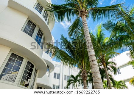 Scenic Miami Beach cityscape with art deco architecture and palm trees.