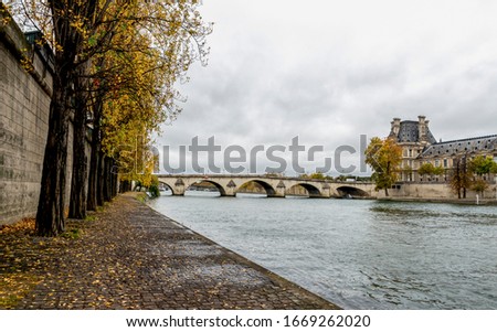 Beautiful autumn scene at Seine river embankment near Pont Royal bridge, Paris, France