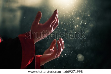 Empty open hands praying on bokeh background
