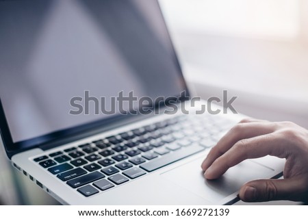 Anonymous man - Hand using Laptop. Security network of connected devices and personal data security   Royalty-Free Stock Photo #1669272139