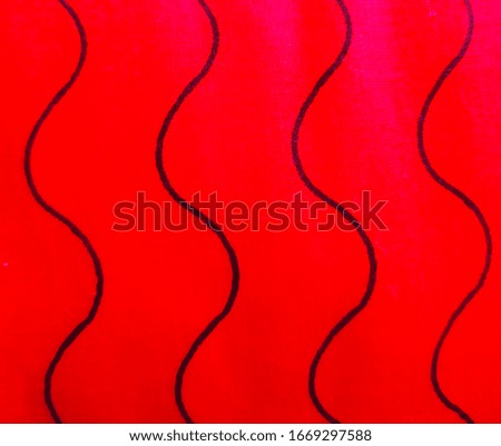 black colored zigzags on red background