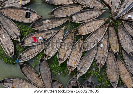 Aerial View of Country Boats Tide Together at the Bank of a River in Dhaka, Bangladesh