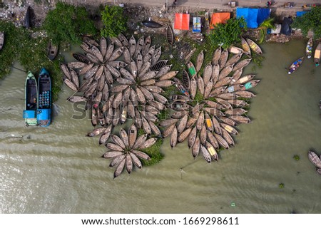 Aerial View of Country Boats Tide Together at the Bank of a River in Dhaka, Bangladesh