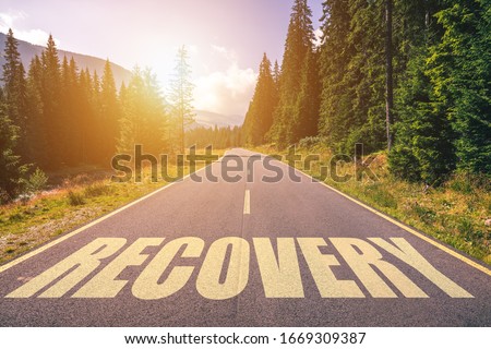Recovery word written on road in the mountains Royalty-Free Stock Photo #1669309387
