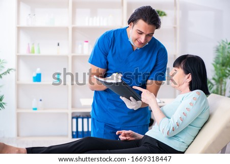 Old woman visiting male doctor for plastic surgery