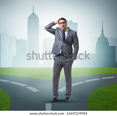 Businessman in difficult choice concept