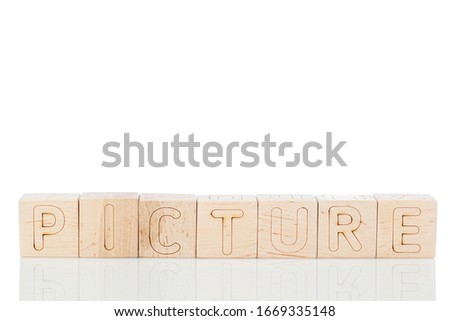 Wooden cubes with word picture on a white background close-up