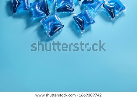 Washing pods on blue background