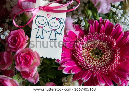 Wedding invitation card with many flowers in the background