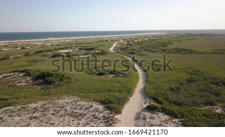 a Sandy path leads from the West End Beach parking lot to the ocean at Jones Beach State Park on Long Island, NY, USA