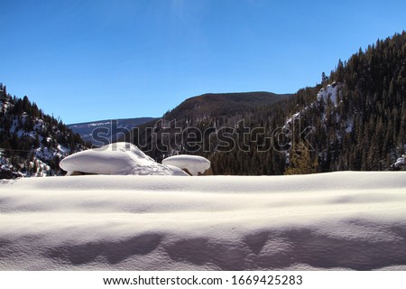 A bed of snow on a mountain cliff in Colorado.