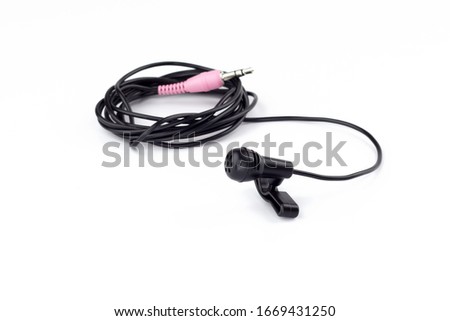 Lapel microphone with wire on a white background.