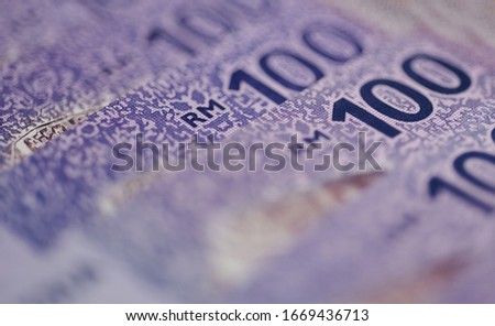 Malaysia currency of Malaysian ringgit banknotes background. Paper money of hundred ringgit notes on etreme closeup. Financial concept.