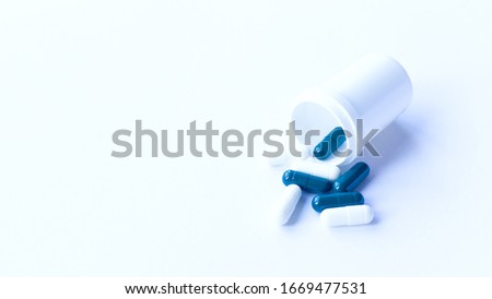 banner with pills fall out of plastick jar classic blue color for medical design. Painkiller, vitamin, antibiotic. 