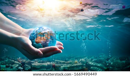 Plastic Waste In The Environment - Ocean Pollution - Hands Holding Earth - elements of this image furnished by NASA
 Royalty-Free Stock Photo #1669490449