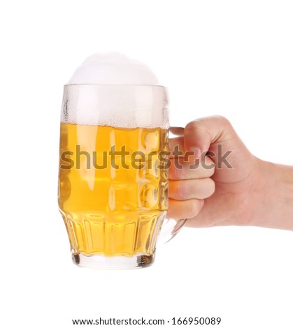 Man hand holds beer in mug. Isolated on a white background.