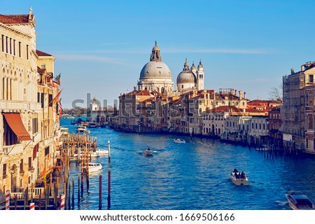 The view on the сathedral of "Santa Maria della Salute" from the bridge of "Ponte dell'Accademia" throw the Grand canal in the City of Venice