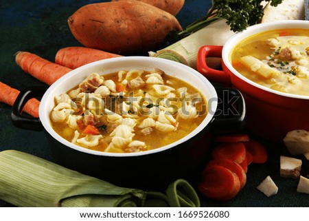 Set of three soups from worldwide cuisines, healthy food. Broth with noodles, beef soup and broth with marrow dumplings. All soups with healthy vegetables.