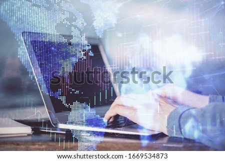 Double exposure of stock market graph with man working on laptop on background. Concept of financial analysis. Royalty-Free Stock Photo #1669534873
